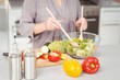 © WavebreakmediaMicro - Midsection of woman preparing salad