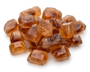 Brown caramelized lump cane sugar cube isolated on white backgro