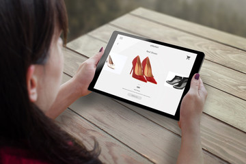 Aufkleber - Shopping with tablet. Woman buy red shoes on online market.