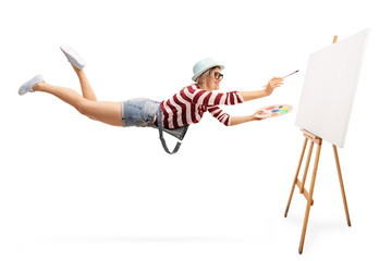 Poster - Flying female artist with a paintbrush