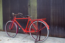 Classic Bicycle At Rusty Zinc Door.