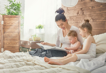 Wall Mural - mother reading a book