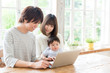 © taka - asian family using laptop