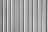 Fototapeta Desenie - Seamless abstract background grey silver aluminium metal plate texture with vertical lines pattern.