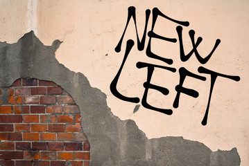 Handwritten graffiti New Left sprayed on the wall, anarchist aesthetics. Rise of left oriented parties - Syriza, Podemos, Die Linke, Corbyn, Sanders