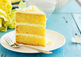 Wall Mural - A piece of lemon sponge cake on a plate.