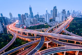 Fototapeta Paryż - Aerial view of a highway overpass at night in Shanghai -  China.