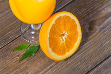 Wall Mural - Fresh orange juice with ice  on wooden background