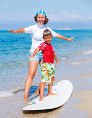 Wall Mural - Boy learning surfing