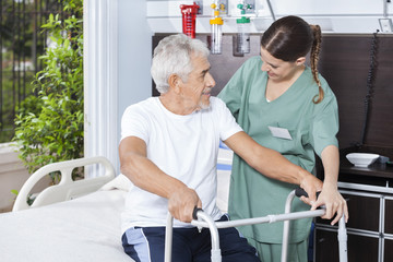 Poster - Smiling Man Being Helped By Nurse In Using Zimmer Frame