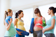 © Syda Productions - group of happy pregnant women talking in gym