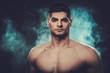 © Nejron Photo - Handsome hispanic man with naked torso posing on smoked dark background.