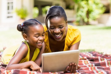 Wall Mural - Happy family watching a laptop