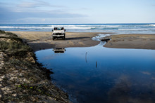 Land Rover Defender Preparing To Cross A Lake Formed On The Sand In Fraser Island, Australia