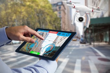 Poster - Composite image of man using tablet pc 