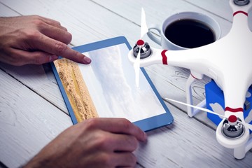 Poster - Composite image of a drone bringing a blue cube