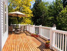 Home Outdoor Cedar Deck With Blooming Trees 