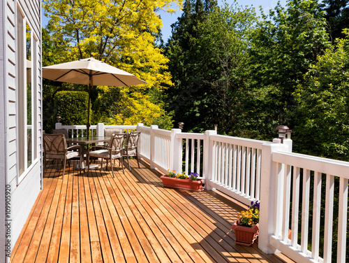 Fotografie, Obraz Home outdoor cedar deck with blooming trees