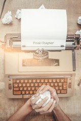 Poster - Final chapter  against above view of old typewriter