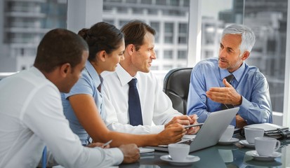 Group of business people brainstorming together