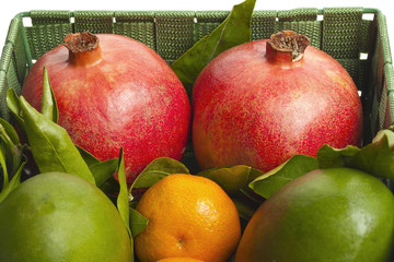 Wall Mural - pomegranate and citrus fruits in basket