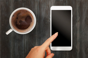 Aufkleber - Woman touch smart phone with isolated white screen for mockup. Top view scene with coffee.