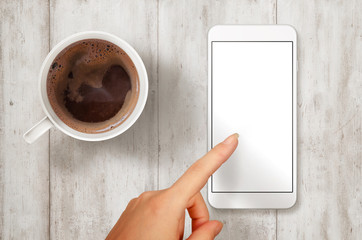 Aufkleber - Woman touch smart phone with isolated white screen for mockup. Top view scene with coffee.