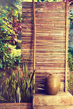 Bamboo Fence With Plants . Plants On A Bamboo Wall . Landscape Design . The Design And Decoration Of The Garden