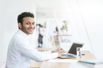 Sticker - Attractive young man is working on a computer