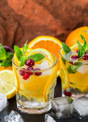 Wall Mural - Lemonade - a refreshing drink made of citrus and berries with mint and ice. Selective focus
