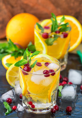 Wall Mural - Lemonade - a refreshing drink made of citrus and berries with mint and ice. Selective focus
