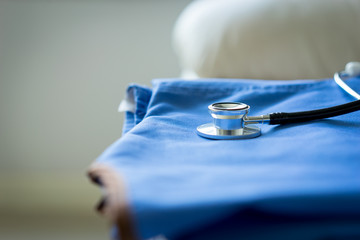 Stethoscope on nurse & doctor coat background