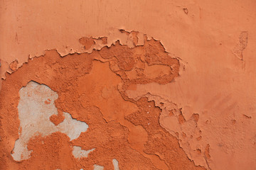 Wall Mural - Old terracotta painted stucco wall with chipped paint. Backgroun