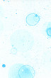 Abstract watercolor blue stain background with blue soap round bubbles and splash. Many blue circles and dots. Blue soapy bubbles.