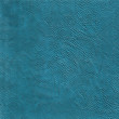 Blue leather texture background. Blue handbag leather. Closeup blue texture skin. Leatherwork structured.