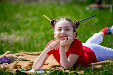 portrait of a funny little girl in glasses.