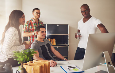 Wall Mural - Group of young entrepreneurs in meeting