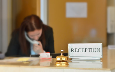 hotel reception desk with bell