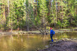 © Serg_Zavyalov_photo - young woman catches fish in the early spring