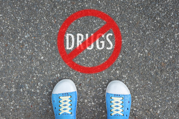 Wall Mural - Teenager standing at NO DRUGS ZONE