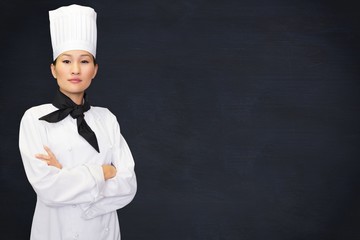 Composite image of portrait of confident female cook in kitchen