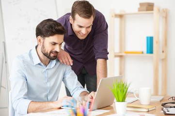 Sticker - Cheerful young businessmen are using computer