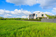 Modern house on green meadow in rural landscape of Krakow, Poland
