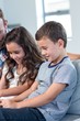 © WavebreakmediaMicro - Father and siblings using digital tablet