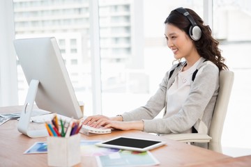 Poster - A woman is listening music 