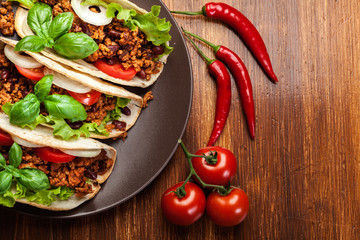 Wall Mural - Mexican tacos with minced meat, beans and spices