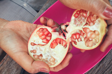 Canvas Print - Pomegranate fruit with hands