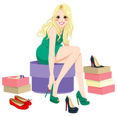 Canvas Print - Beautiful happy blonde girl trying many fashionable shoes