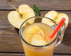 Wall Mural - Fresh apple  juice on wooden background