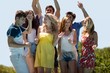 © WavebreakMediaMicro - Happy friends dancing near the swimming pool on a sunny day